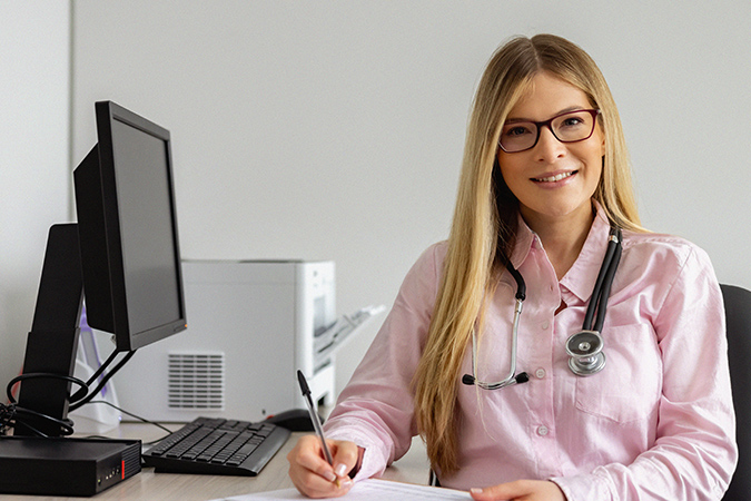 Doctor working at her office
