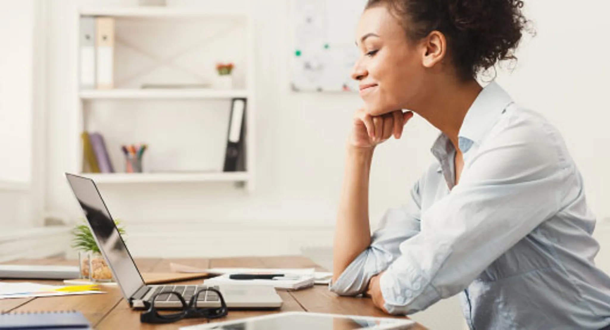Woman looking at laptop